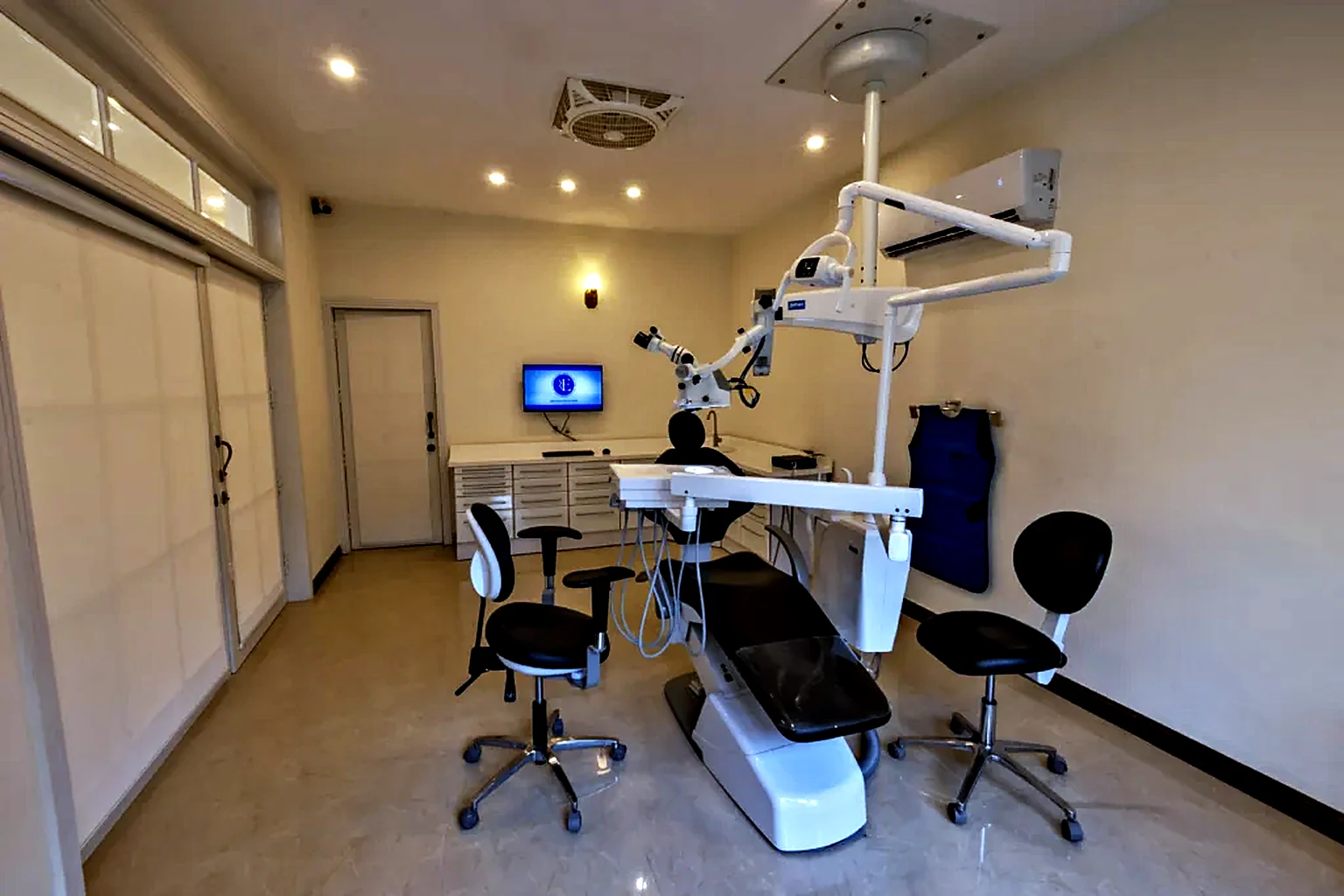 Surgical microscope above the dental chair in the treatment room